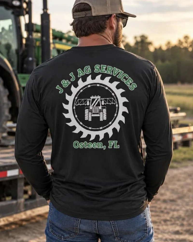 Black long-sleeve shirt printed with the J&J Ag Services logo